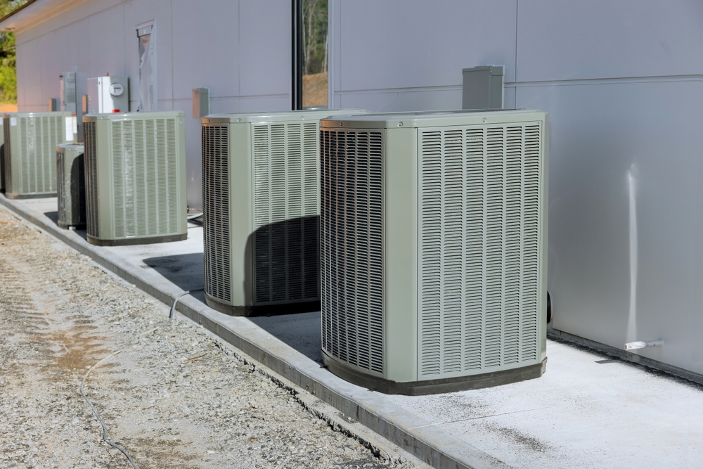 Homeowner checking an AC turning on and off every 5 minutes during a cooling issue