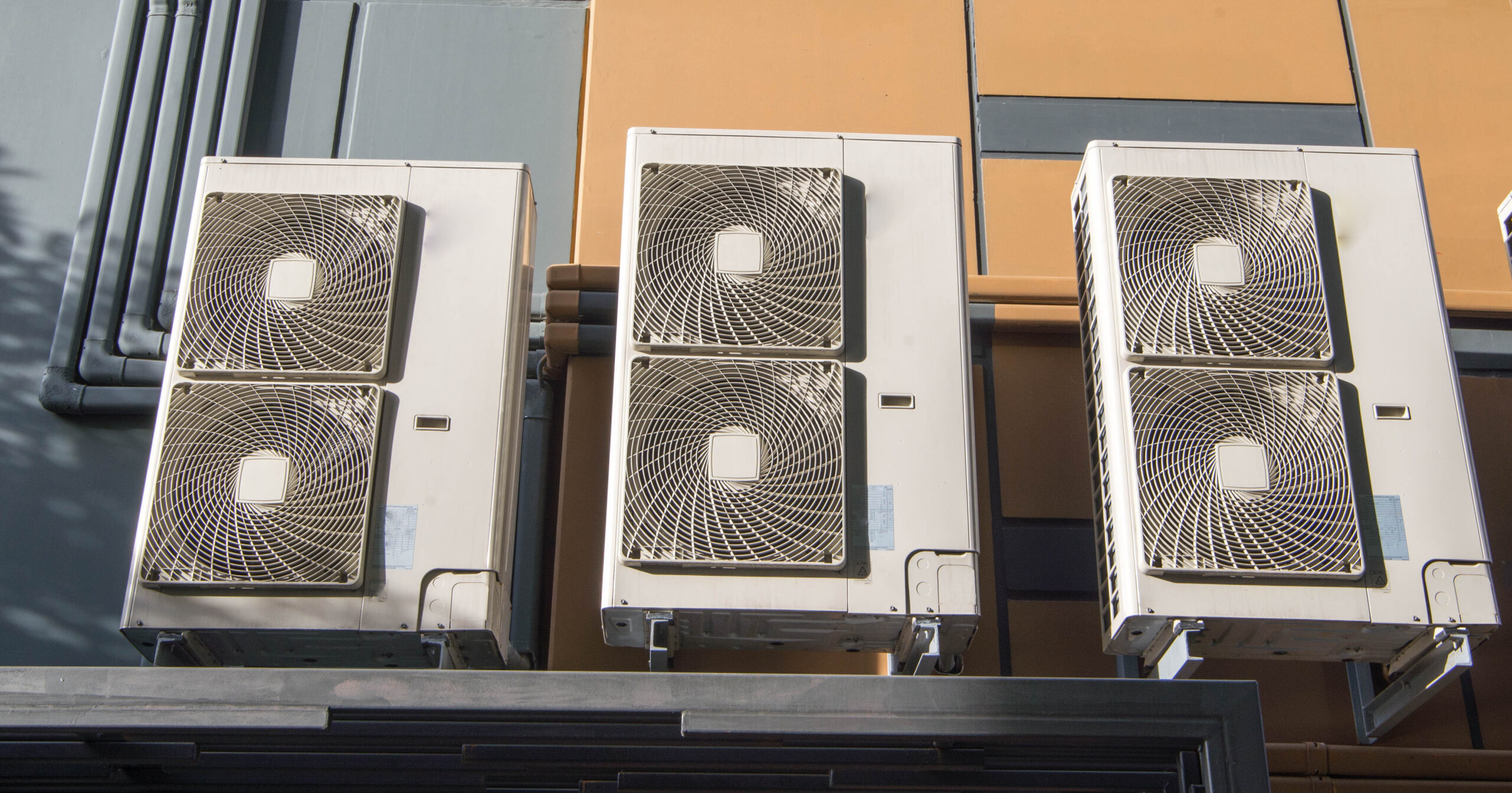 Outdoor AC unit operating in hot Texas weather near a residential home