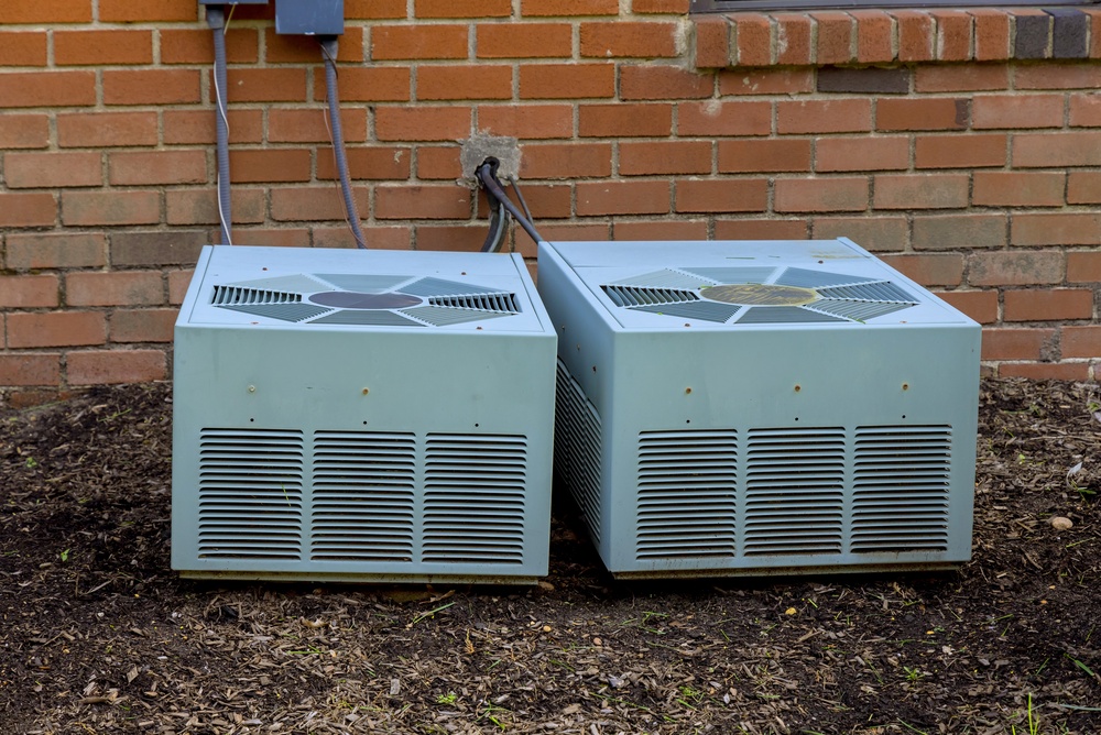 HVAC technician completing a new AC installation to improve indoor air quality and efficiency